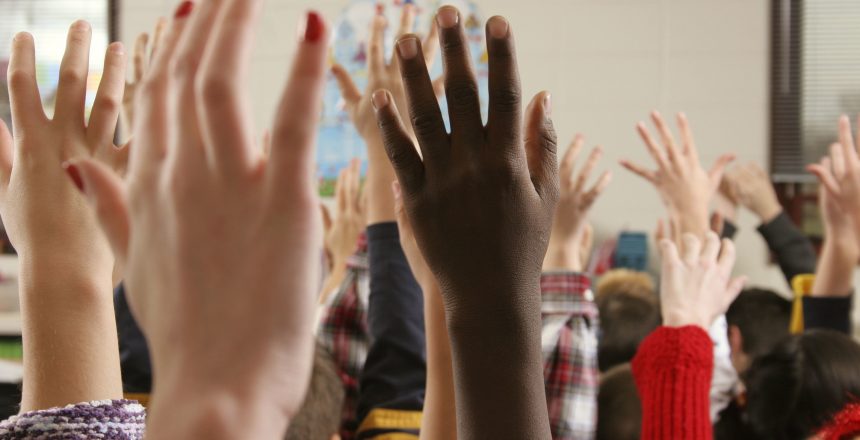 hands in air shot at public school in suburb of Chicago, Illinois. USA